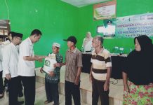 Pj.Bupati Pringsewu Serahkan Bantuan Pangan Beras
